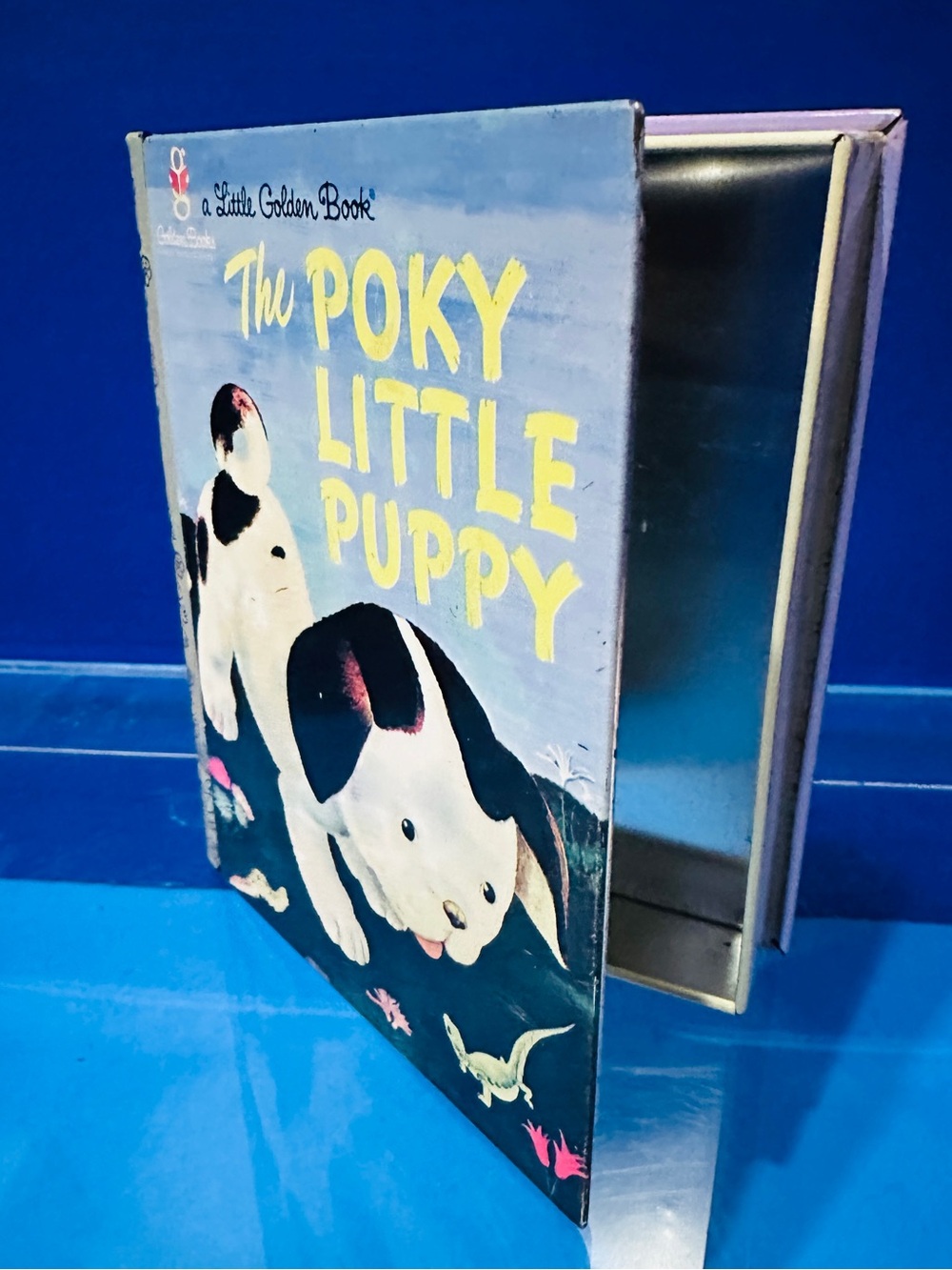 'A Little Golden Book “The Poky Little Puppy' Collectors Tin Shaped Like A Book